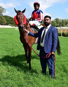 City Of Hustle (Dharshan Antony B up), winner of the NANJANGUD PLATE being led in by trainer Aditya K on Wednesday races at Mysore.